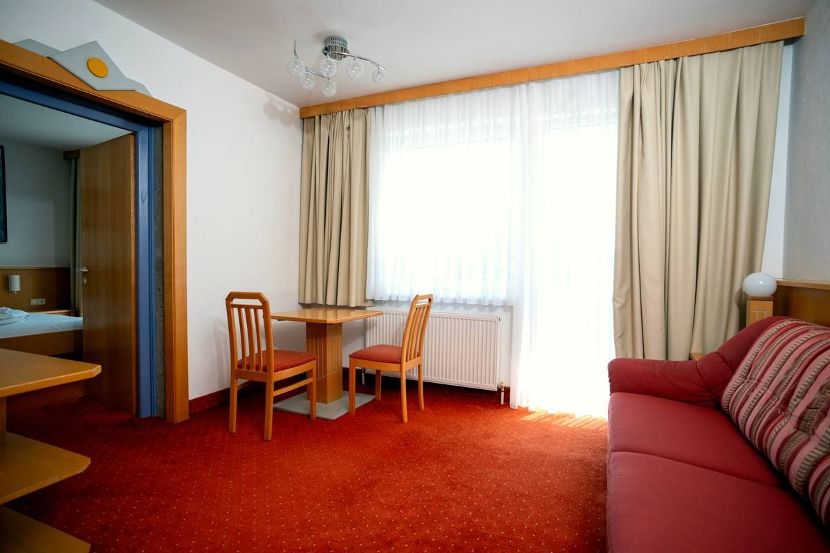 Suite with living area at Strandhotel Faak