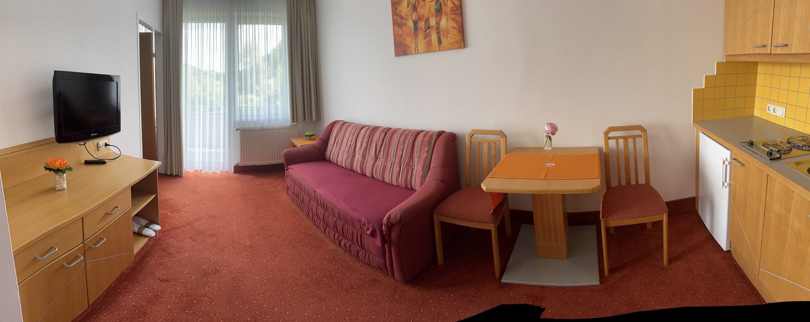 Living area of Suite Type B with kitchenette at the Strandhotel Faak